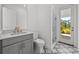 Bathroom features a glass-enclosed shower and patterned tile floors at 33736 Ocean Spray Ln, Wesley Chapel, FL 33543