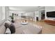 Bright, open living area with wood floors, neutral tones, and a convenient bar area with wine cooler at 33736 Ocean Spray Ln, Wesley Chapel, FL 33543