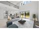 Bright living room featuring high ceilings, modern decor, and an open floor plan at 33736 Ocean Spray Ln, Wesley Chapel, FL 33543