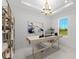 Well-lit home office featuring a large window and a modern, minimalist design at 33736 Ocean Spray Ln, Wesley Chapel, FL 33543