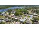 Aerial view of a residential neighborhood with lake views, showcasing community at 3948 Tarpon Pointe Cir, Palm Harbor, FL 34684