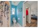 Bathroom with shower, toilet, and small window, adjacent to bedroom at 3948 Tarpon Pointe Cir, Palm Harbor, FL 34684