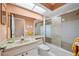 Functional bathroom with a shower and tub combo and vanity at 3948 Tarpon Pointe Cir, Palm Harbor, FL 34684