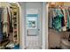 Walk-in closet connecting to bathroom and bedroom, great for storage at 3948 Tarpon Pointe Cir, Palm Harbor, FL 34684