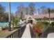 Exterior view of community building near pool featuring landscaped entrance at 3948 Tarpon Pointe Cir, Palm Harbor, FL 34684
