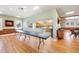 Community center with wood floors, wainscoting, and a pass-through to the community kitchen at 3948 Tarpon Pointe Cir, Palm Harbor, FL 34684