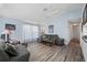 Open living room featuring wood flooring, stylish decor, and comfortable seating arrangements at 3948 Tarpon Pointe Cir, Palm Harbor, FL 34684