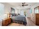 Cozy bedroom with wood floors, soft lighting, and a comfortable seating area at 3948 Tarpon Pointe Cir, Palm Harbor, FL 34684