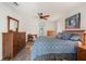 Comfortable bedroom with wood floors, ceiling fan, and natural light at 3948 Tarpon Pointe Cir, Palm Harbor, FL 34684