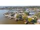 Panoramic aerial shot showcasing waterfront homes with private docks and lush surroundings of tranquil waterways at 4036 Church Creek Pt, Largo, FL 33774