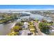Stunning aerial view of waterfront homes nestled in a picturesque bay setting with beautiful foliage and waterways at 4036 Church Creek Pt, Largo, FL 33774