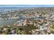 Expansive aerial view of a waterfront home with easy access to the open bay and scenic views at 4036 Church Creek Pt, Largo, FL 33774