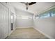 Bedroom with wood floors, closet, and ample natural light from two windows at 4036 Church Creek Pt, Largo, FL 33774
