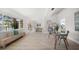 Open-concept living space offers a comfortable seating area, natural light, and views of the waterway at 4036 Church Creek Pt, Largo, FL 33774