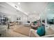 Expansive living room features contemporary furnishings, wood floors, and lots of natural light at 4036 Church Creek Pt, Largo, FL 33774