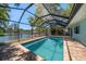 Inviting pool featuring a screened enclosure and views of the waterfront at 4036 Church Creek Pt, Largo, FL 33774