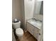 Convenient half bath with modern fixtures and white cabinetry at 4201 La Palma Ct, Tampa, FL 33611