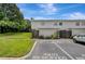 Charming two-story townhome with reserved parking space and fenced front patio at 4201 La Palma Ct, Tampa, FL 33611
