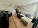 Spacious living room featuring hardwood floors and comfortable seating at 4201 La Palma Ct, Tampa, FL 33611