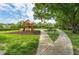 Community playground area with swings, slide, and benches for relaxation at 4201 La Palma Ct, Tampa, FL 33611