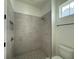 Modern shower with gray tile, rainfall showerhead, and a convenient niche at 5011 21St N Ave, St Petersburg, FL 33710