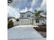 Charming two-story home featuring a classic white exterior and a welcoming two-car garage at 5011 21St N Ave, St Petersburg, FL 33710