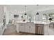 Kitchen with island and stainless steel dishwasher connects to a living area with backyard views at 5011 21St N Ave, St Petersburg, FL 33710