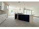 Stylish kitchen island features a sink, dark cabinetry, and granite countertops at 5011 21St N Ave, St Petersburg, FL 33710