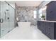 Well-lit bathroom features a stand-alone tub, large shower, and double vanity at 526 39Th S Ave, St Petersburg, FL 33705