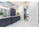 Stunning bathroom featuring a double vanity, marble countertops, and a beautifully tiled accent wall at 526 39Th S Ave, St Petersburg, FL 33705
