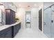 Spacious bathroom showcasing double vanity, a walk-in shower, and neutral color palette at 526 39Th S Ave, St Petersburg, FL 33705