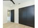 Bedroom showcasing light floors, fresh paint, and modern closets with stylish black doors and hardware at 526 39Th S Ave, St Petersburg, FL 33705