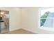 Bright bedroom with large windows, light wood flooring, and neutral paint at 526 39Th S Ave, St Petersburg, FL 33705