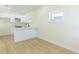 Well-lit kitchen area showcasing white cabinetry, countertops, flooring and natural light at 526 39Th S Ave, St Petersburg, FL 33705
