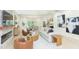 Open concept living room and dining room boasts wood floors and large windows at 526 39Th S Ave, St Petersburg, FL 33705