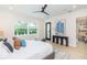 Bright main bedroom with large window, wood floors, and view of open-concept living at 526 39Th S Ave, St Petersburg, FL 33705