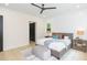 Comfortable main bedroom featuring neutral tones, a ceiling fan, and natural lighting at 526 39Th S Ave, St Petersburg, FL 33705
