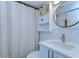 Bright bathroom with modern vanity, elegant mirror, and shower curtain at 527 S Lincoln Ave # A108, Tampa, FL 33609