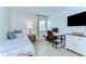 Bright room with a desk, TV, bed and bright window at 527 S Lincoln Ave # A108, Tampa, FL 33609