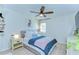 This cozy bedroom offers a ceiling fan, stylish decor, and natural light at 527 S Lincoln Ave # A108, Tampa, FL 33609