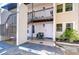 Cozy condo entrance featuring a charming seating area and well-maintained landscaping at 527 S Lincoln Ave # A108, Tampa, FL 33609