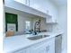 Bright kitchen features stainless steel appliances, white cabinetry, and eat in dining space at 527 S Lincoln Ave # A108, Tampa, FL 33609