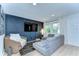 Comfortable living room featuring modern furniture, a stylish rug, and ample natural light at 527 S Lincoln Ave # A108, Tampa, FL 33609