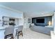 Open-concept living area featuring a sleek breakfast bar, modern decor, and a comfortable sofa at 527 S Lincoln Ave # A108, Tampa, FL 33609