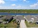 Aerial view of home backing up to a lake, and showcasing waterfront property at 5425 Rainwood Meadows Dr, Apollo Beach, FL 33572