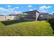 Large, well-maintained backyard with a screened-in patio, perfect for outdoor entertaining and relaxation at 5425 Rainwood Meadows Dr, Apollo Beach, FL 33572