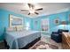 Peaceful bedroom with a ceiling fan, plantation shutters, and a comfortable armchair at 5425 Rainwood Meadows Dr, Apollo Beach, FL 33572