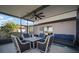 Relaxing screened lanai with ceiling fan, table, chairs, and a comfortable sofa at 5425 Rainwood Meadows Dr, Apollo Beach, FL 33572