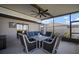 Relaxing screened lanai with ceiling fan, table, chairs, and a comfortable sofa at 5425 Rainwood Meadows Dr, Apollo Beach, FL 33572