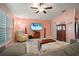 Comfortable living room with a ceiling fan, media center, and lots of natural light at 5425 Rainwood Meadows Dr, Apollo Beach, FL 33572